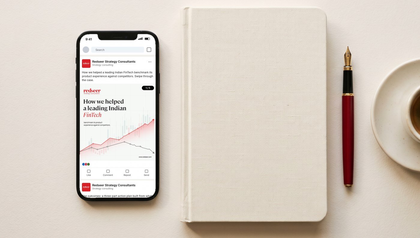 Redseer LinkedIn carousel on a phone next to a notebook and red fountain pen